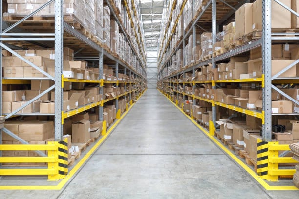 long aisle with shelves in fulfillment warehouse